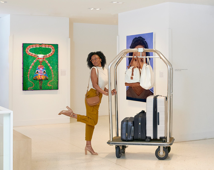 Woman rolling her luggages in a luggage cart
