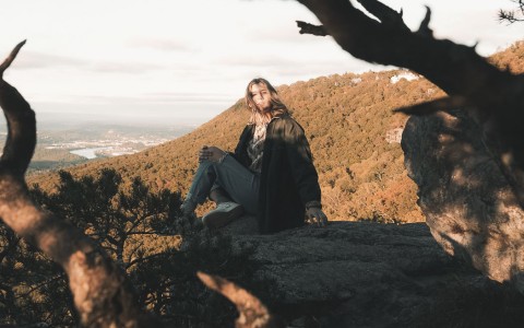 woman on top of a mountain 