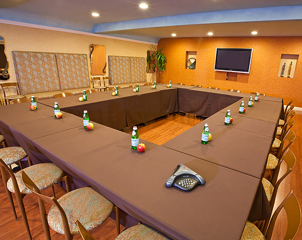 Meeting room with a square shaped conference table