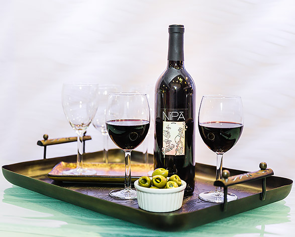 tray with two wine glasses and wine bottle