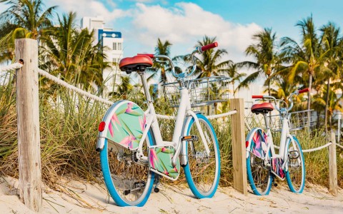 two parked bicycles at the beach