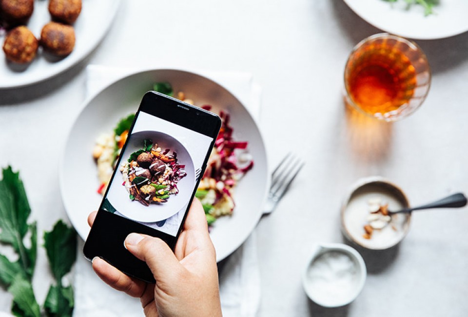 someone taking a photo of the plate served in the tabe