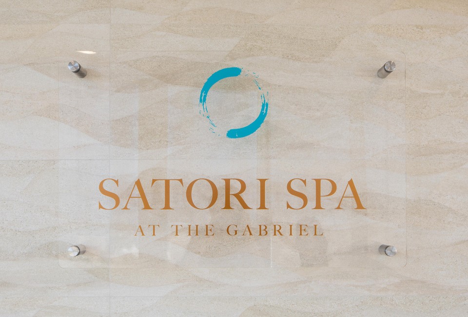 close view of Satori Spa at the Gabriel sign