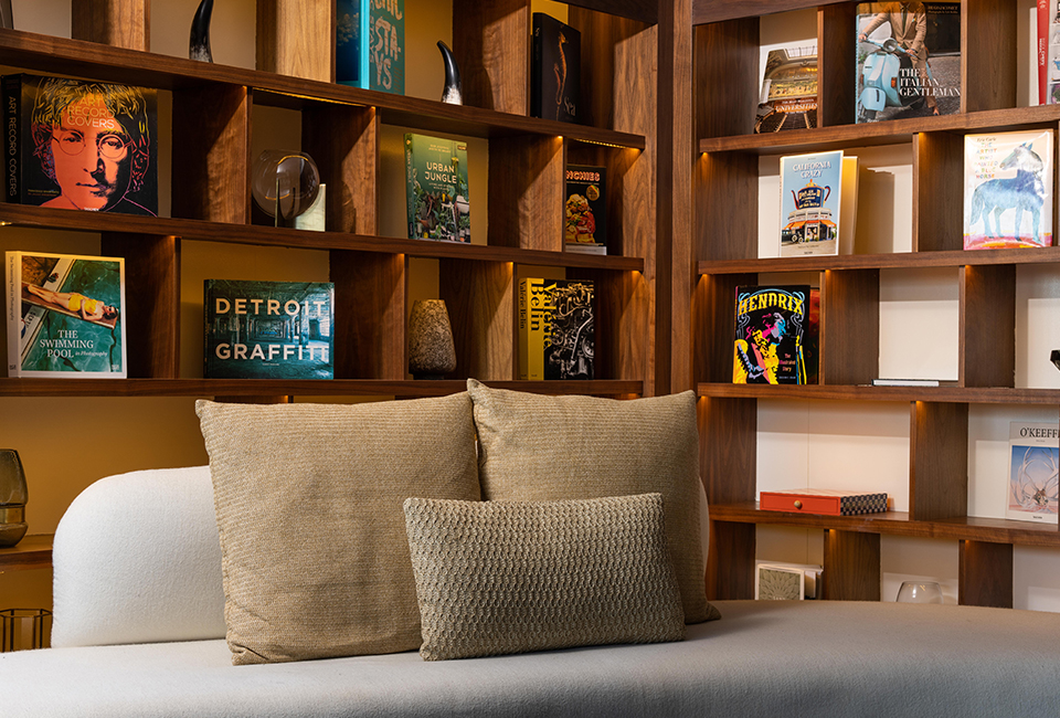 corner of the library lounge with a comfortable sofa and some books in the background