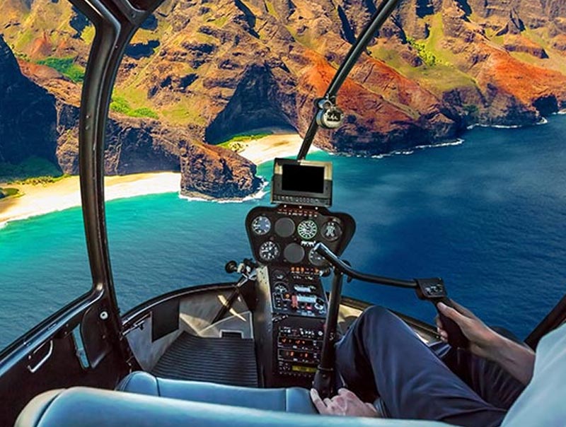 Internal view of men flying a helicopter
