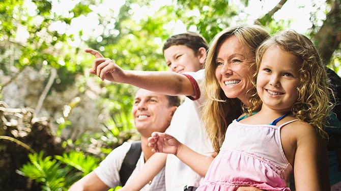 Mother, Father, boy and girl laughing