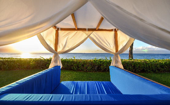 view peering through a cabana out to the ocean