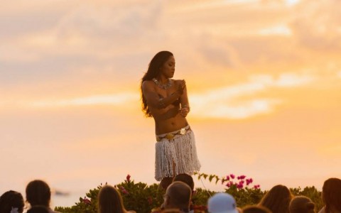 luau dancer with sunset