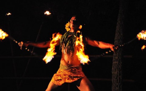 performing traditional fire dance in action