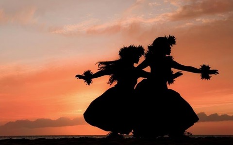 shadows of two dancers as the sun sets outside