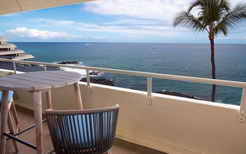 oceanfront balcony with a chair