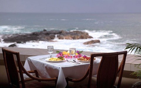 Table set for breakfast by the ocean 