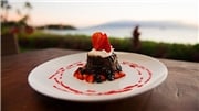 Chocolate dessert with red berries on top