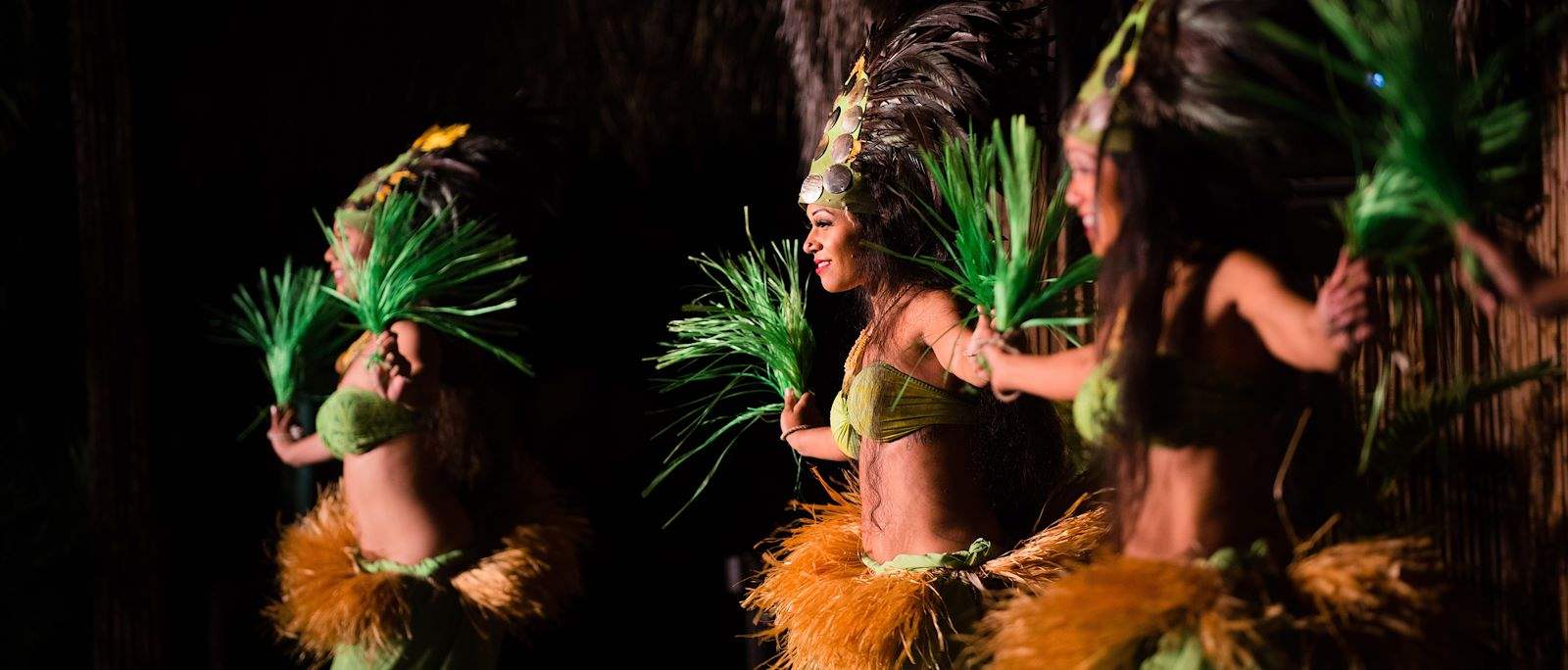 view of performers dancing at a luau