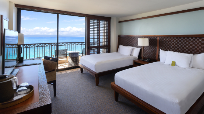 double queen beds in tower overlooking ocean from lanai