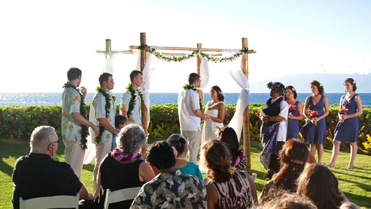 view of a beachfront wedding ceremony