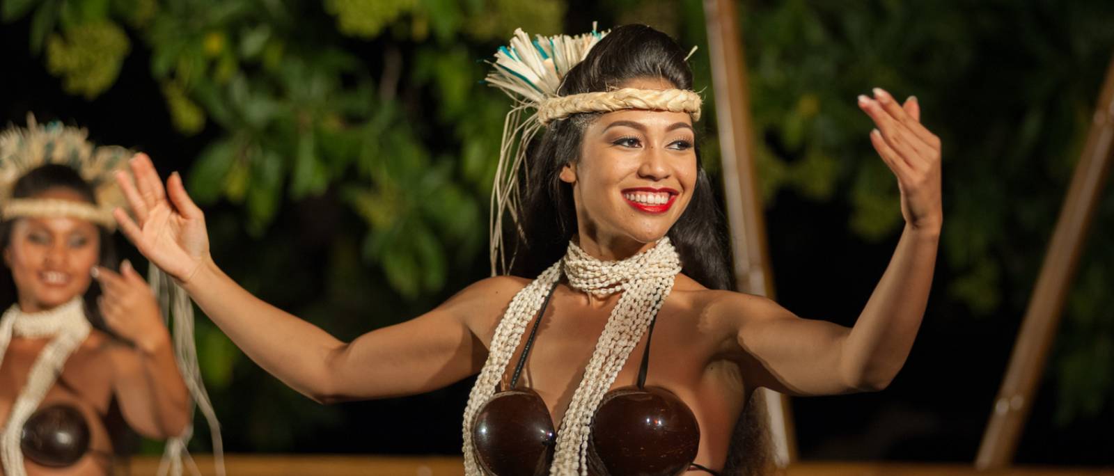 Woman with hula outfit smiling