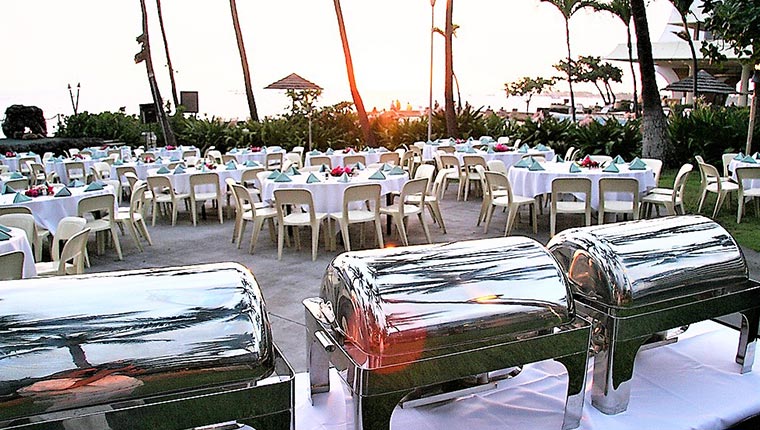 Event arrangement with tables set, chairs and buffet