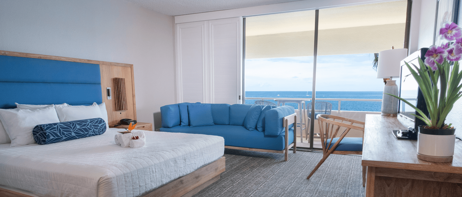 oceanfront room with blue couch