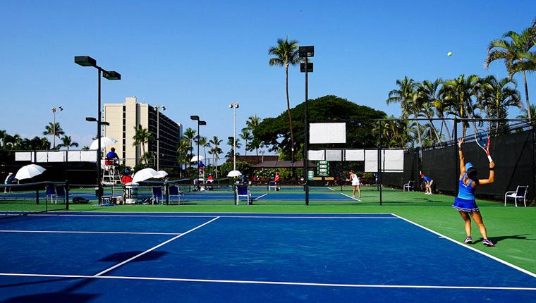 view of property tennis court