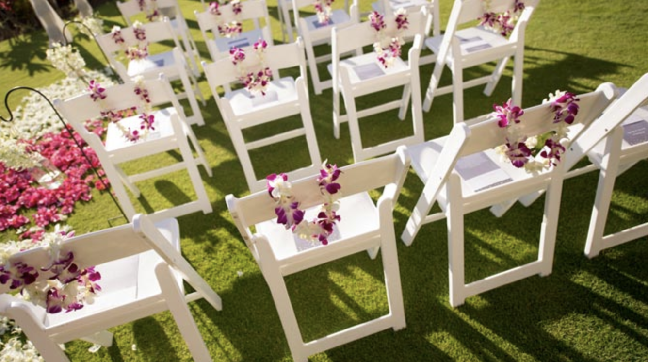 close up of chairs decorated flowers for wedding 