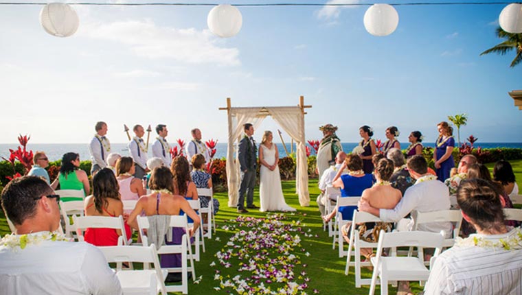 view of a beachfront wedding ceremony