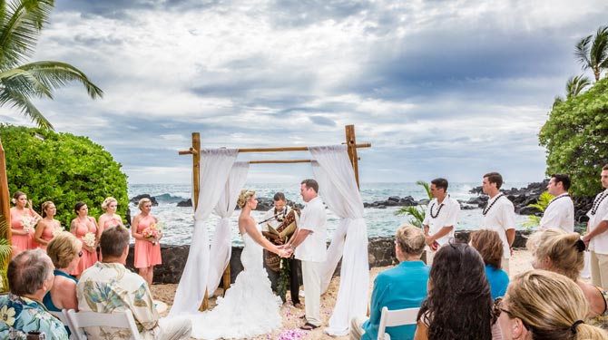 wedding altar in front of the ocean and mountains