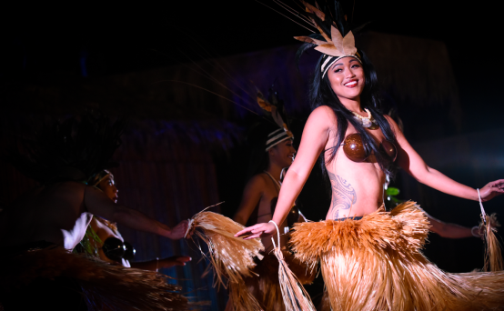 luau dancer with grass skirt and costume