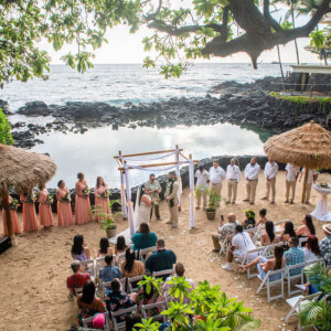 wedding ceremony on beautiful sandy beach overlooking ocean 