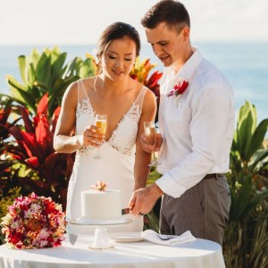 a couple cutting the cake after their wedding