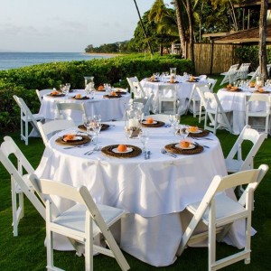 tables set up on the lawn for a wedding reception