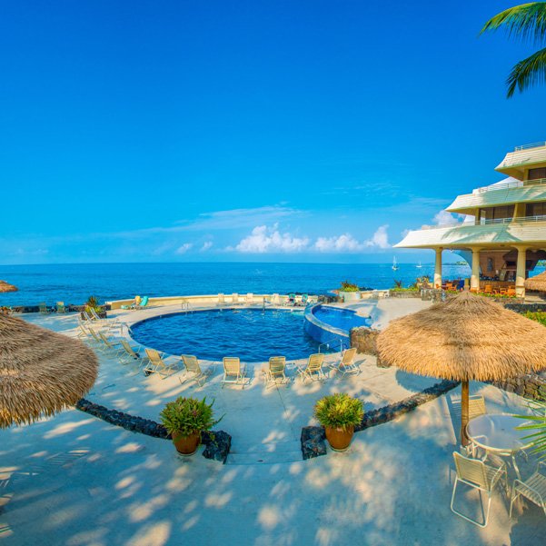 round pool next to beach in beautiful luxury resort