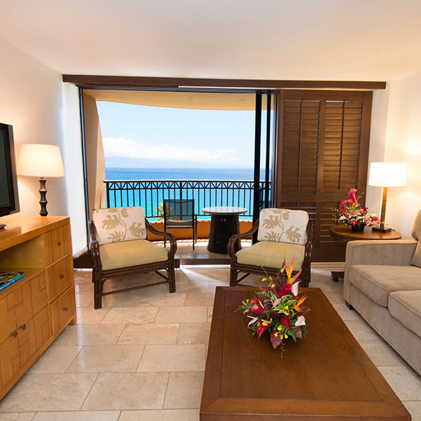 a living room inside of an ocean view suite