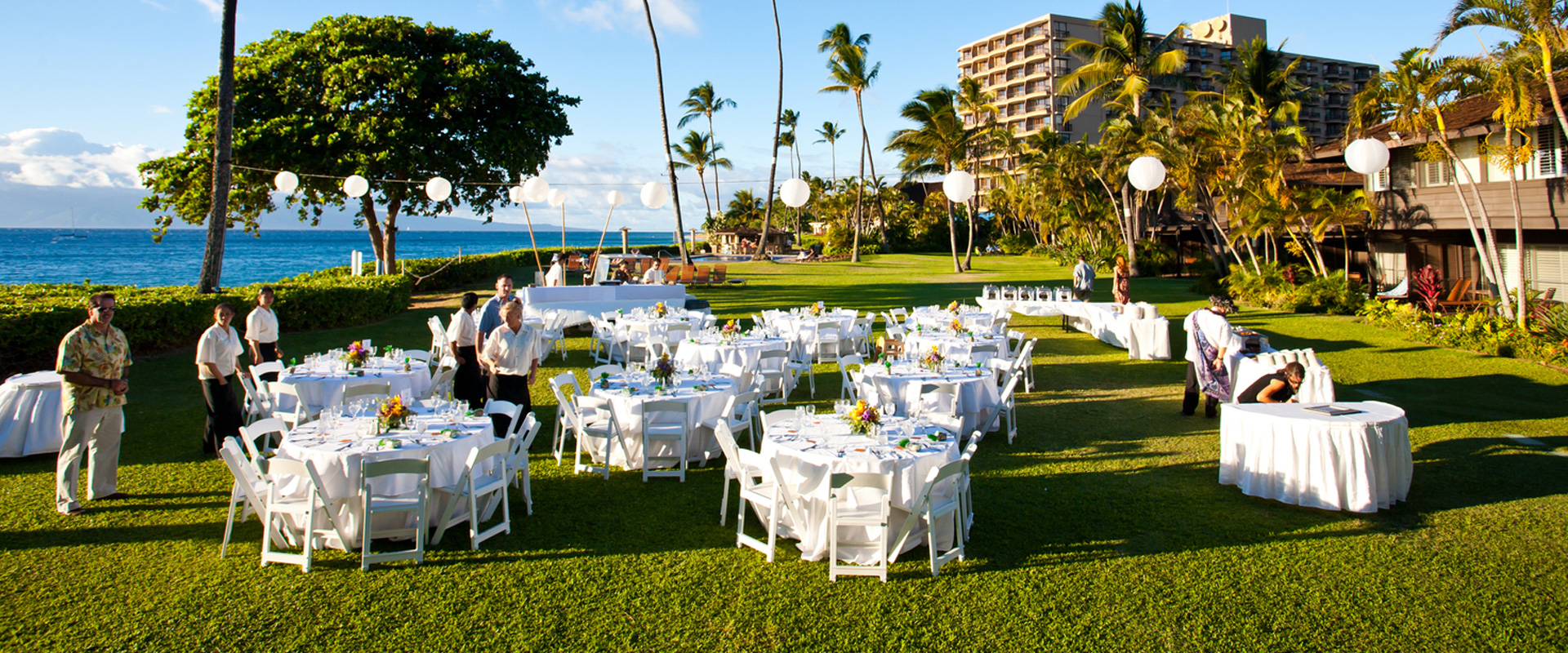 tables set up on the lawn for a reception
