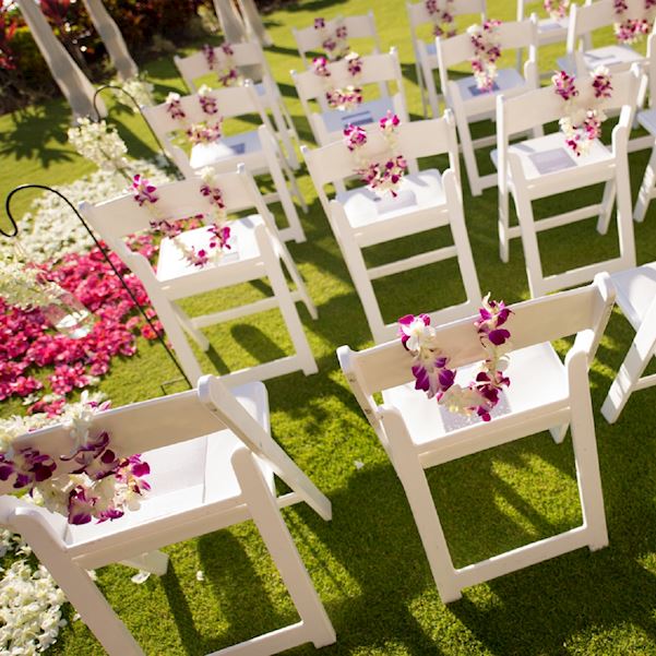 chairs set up on the lawn for a wedding