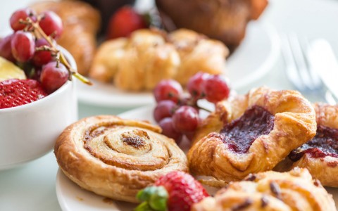 pastries served on a plate with fruit
