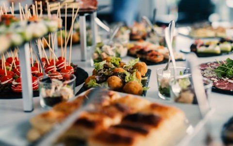 a catering table set up with different appetizers