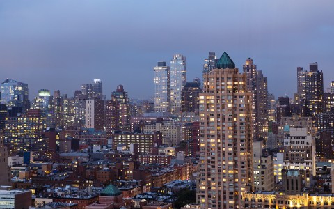 view of new york skyline with buildings in the evening 