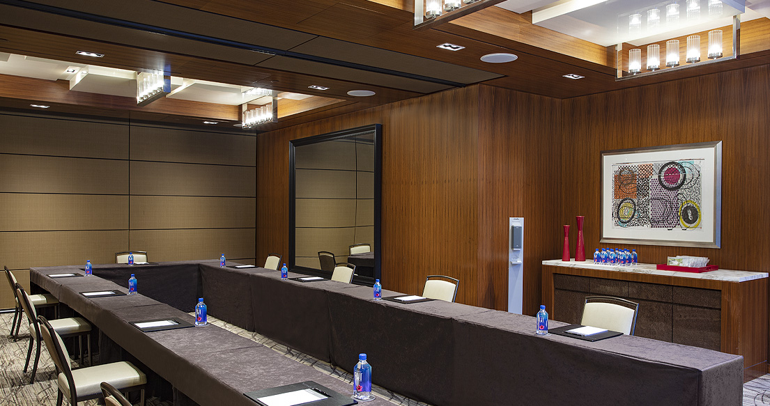 private dining space set up with U-shape meeting table and chairs for meeting