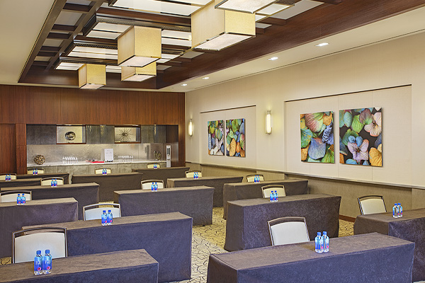 meeting room with multiple tables and chairs