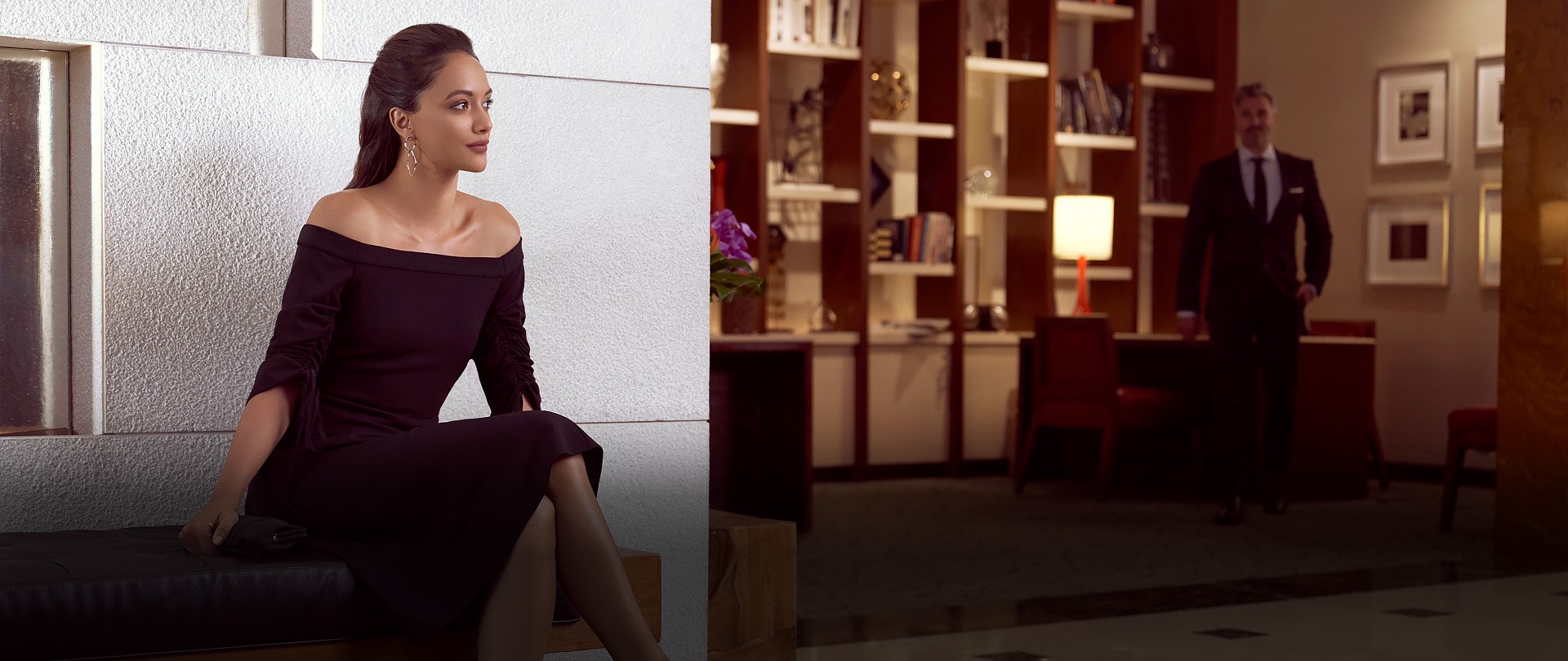 Woman sitting in hotel lobby