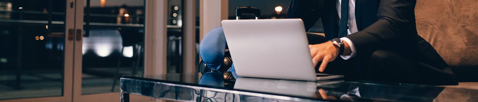 a computer on a glass desk