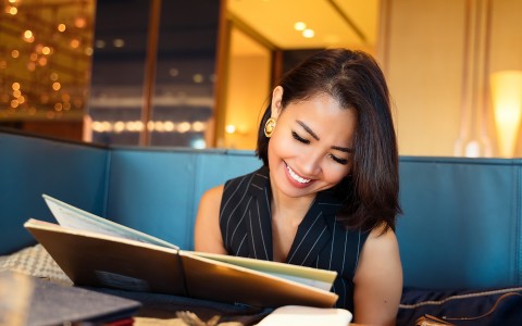 woman reading a menu