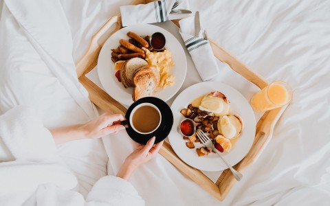 guest having breakfast in bed