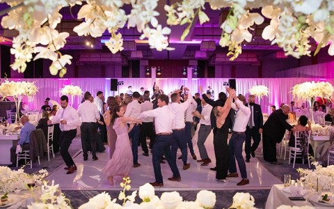 guests at a wedding dancing on the dance floor