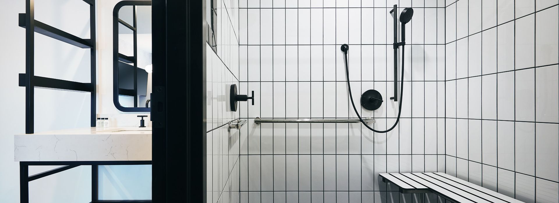 accessible shower with seat and grab bars