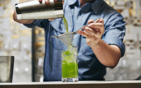 bartender making green drink