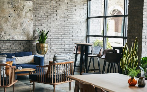 brick walls lounge area with seats