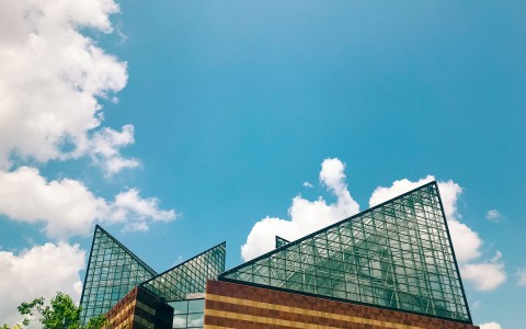 view of the sky and a glass architectural building