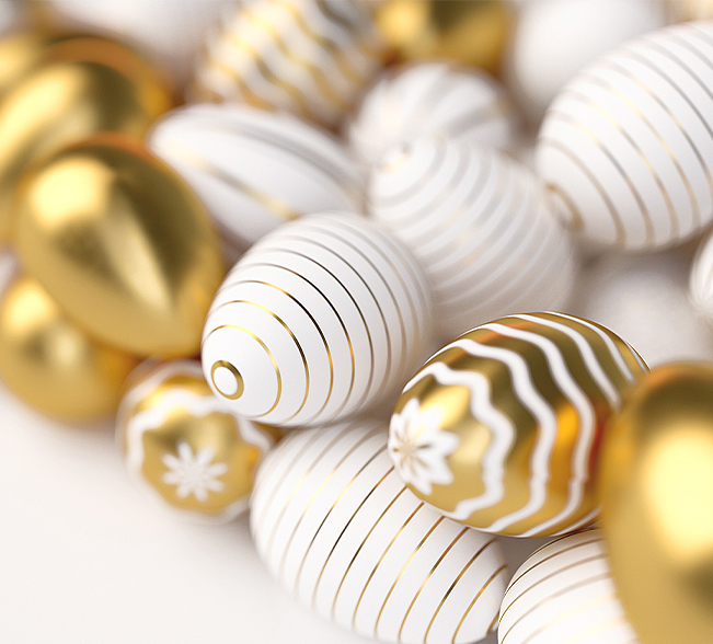 gold and white easter eggs with different designs all bunched together